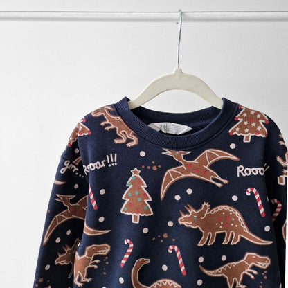 Pre-Loved Kids džemperis ar piparkūku dinozauriem | 4–6 gadi