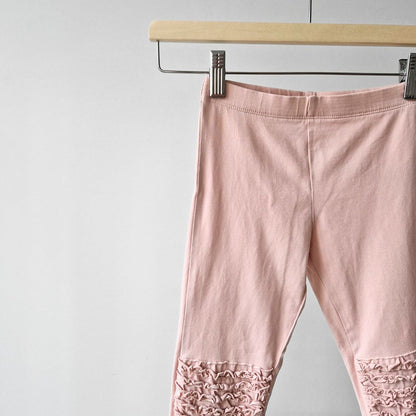 Pre-Loved Legingi – Maigi rozā ar volāniem | 116 izm.