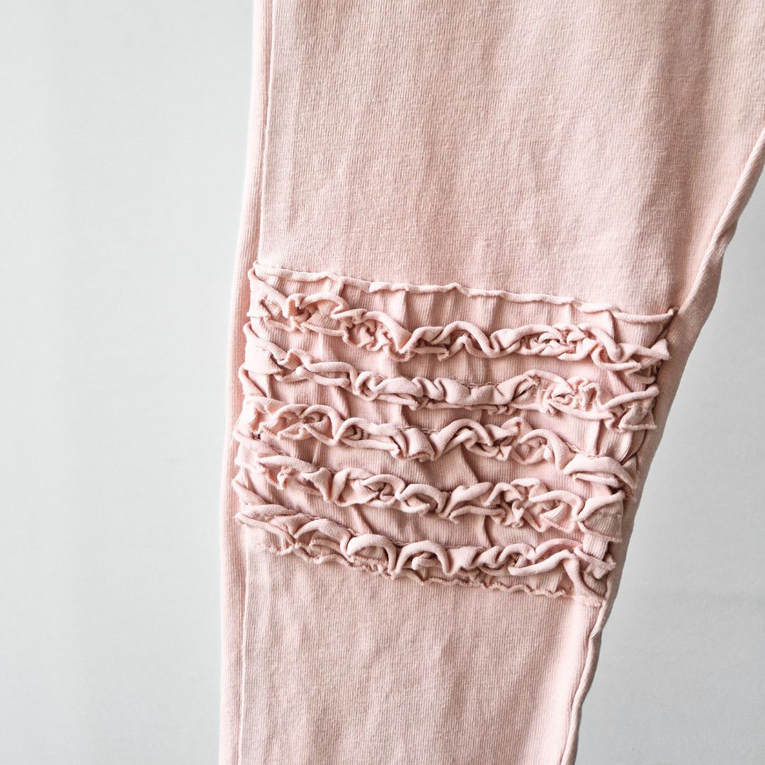 Pre-Loved Legingi – Maigi rozā ar volāniem | 116 izm.