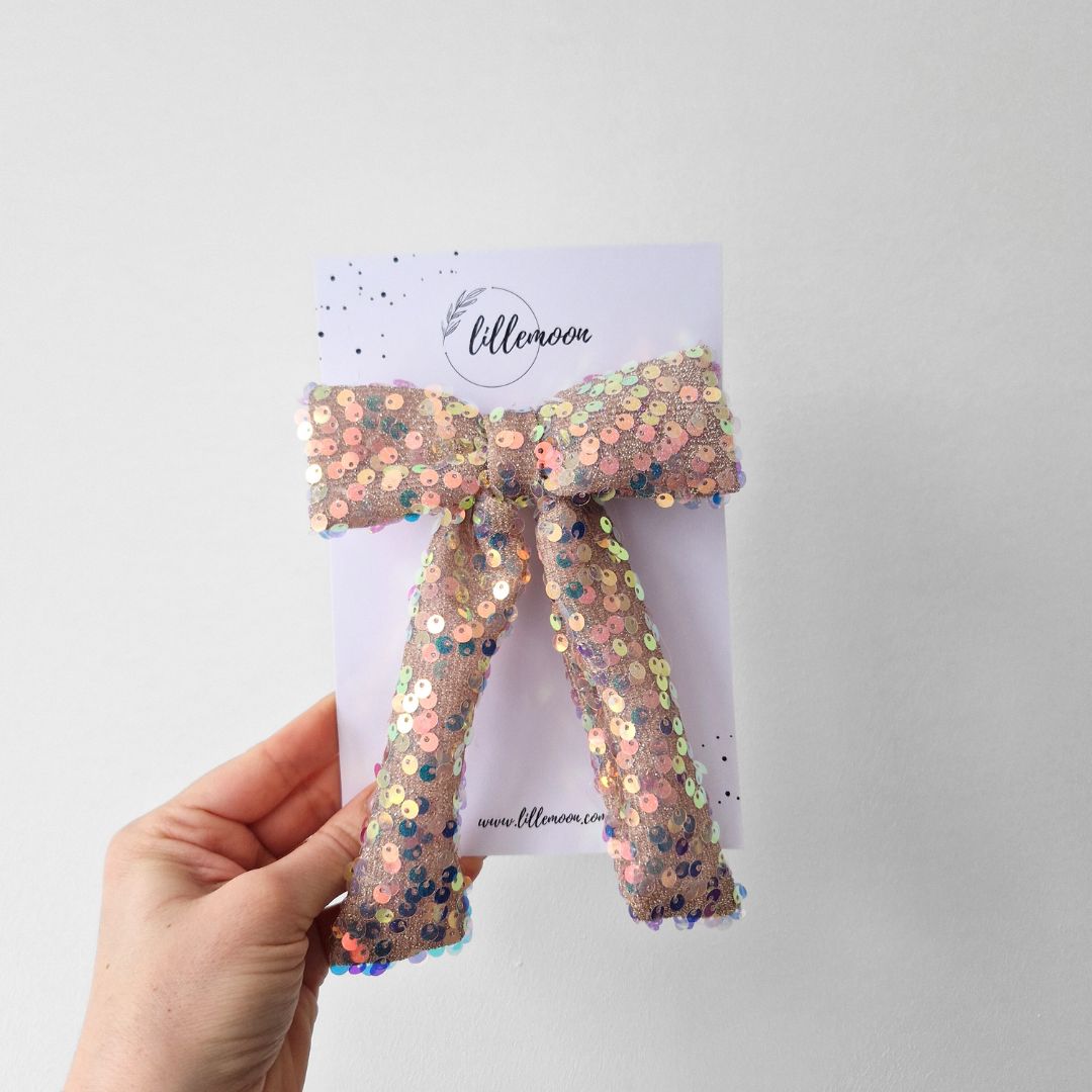 Glitteru varavīksnes matu bante svētkiem | Ierobežots daudzums